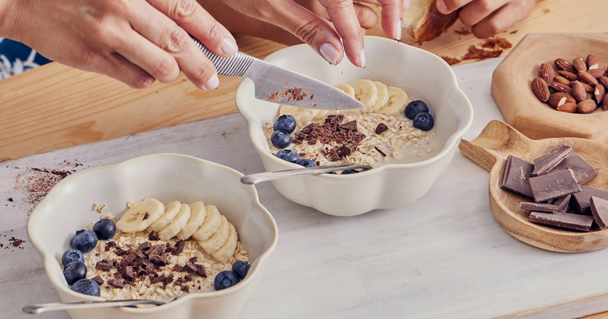 Bowl of top foods for gut health - oatmeal, yoghurt and berries