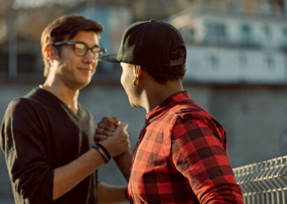 Two men supporting each other